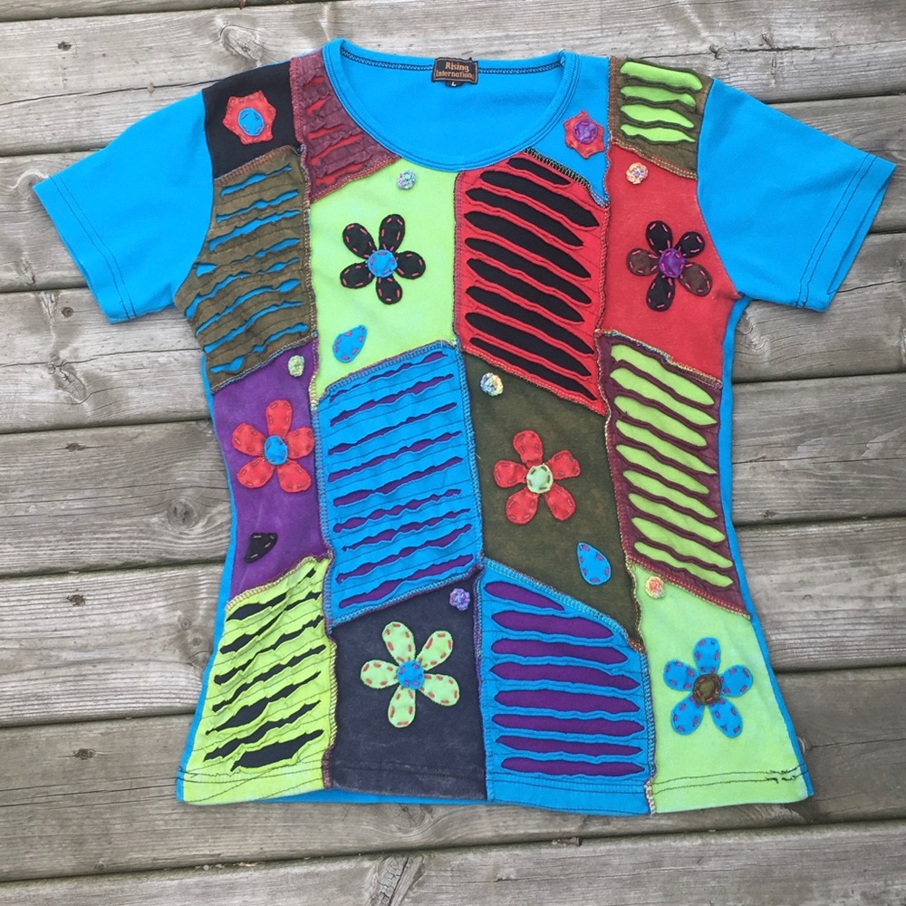 Colourful flower Rising International t-shirt
